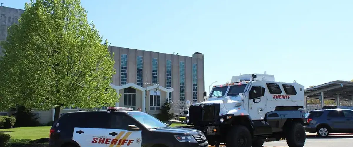 Suffolk County Sheriff's Office vehicle and sheriff's patrol car.
